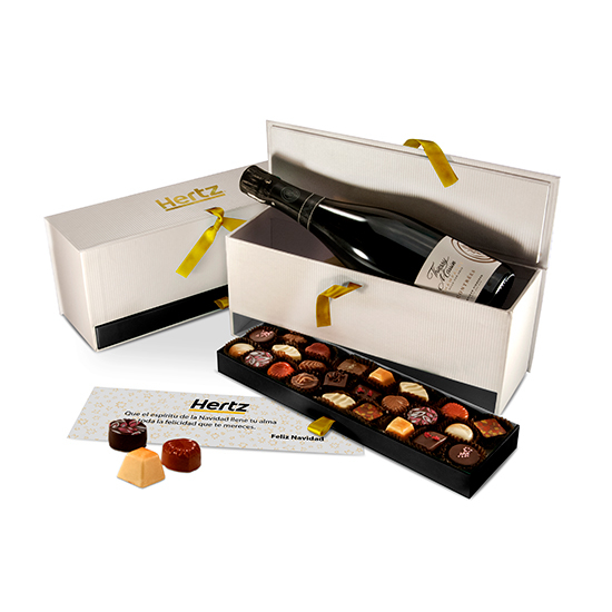 Box with bottle of champagne and handmade chocolates