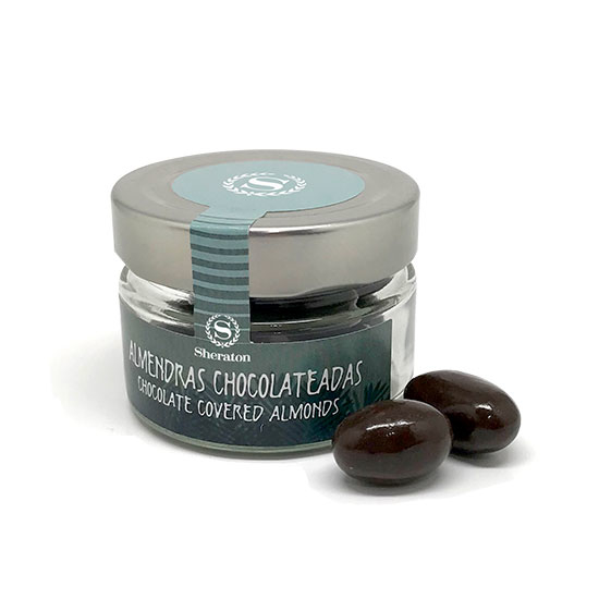 Glass jar with chocolate almonds
